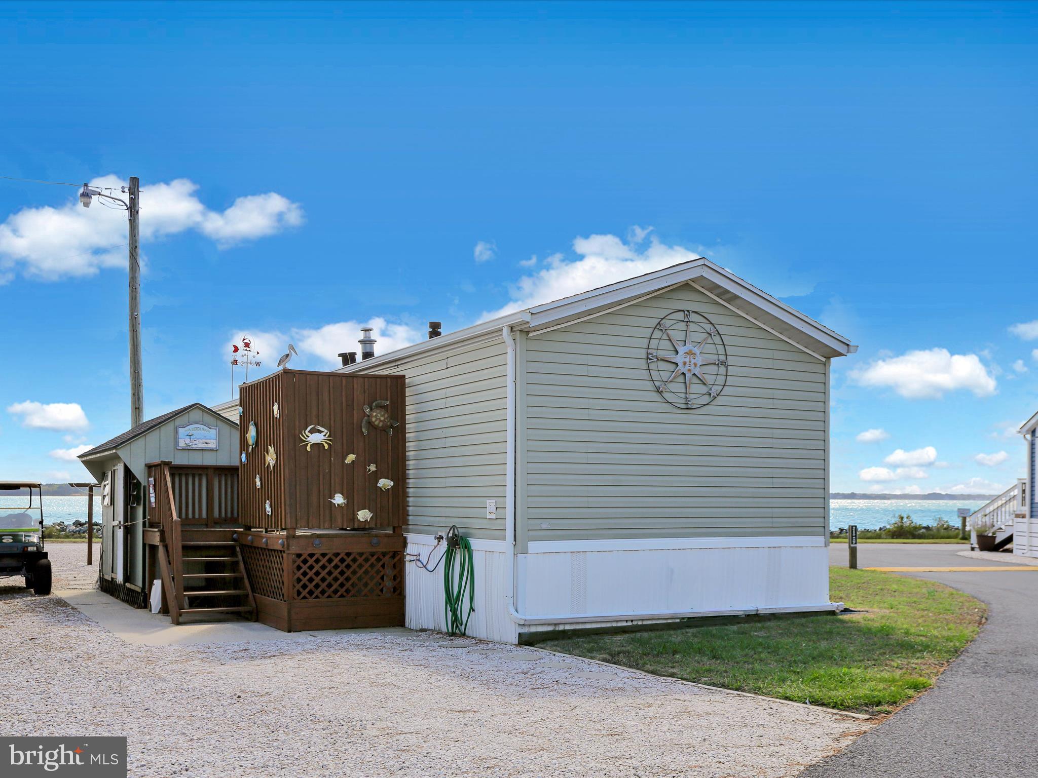 27412 Grove Circle Road Millsboro, DE 19966 - Photo 8 of 43 a view of a house with a yard