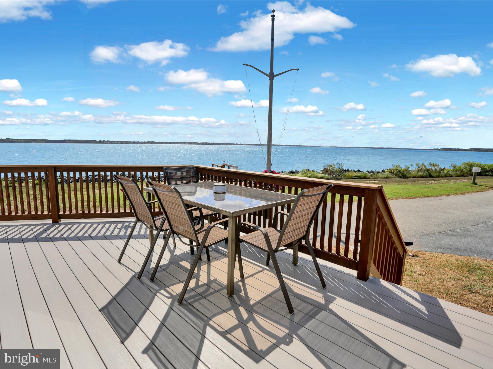 27412 Grove Circle Road Millsboro, DE 19966 - Photo 10 of 43 a view of balcony with furniture and wooden floor