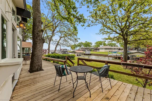 a view of a chairs and table on the deck