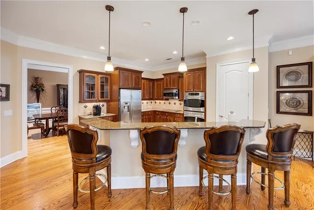 a spacious bathroom with a tub sink and mirror