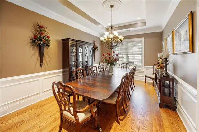 a kitchen with sink refrigerator and microwave