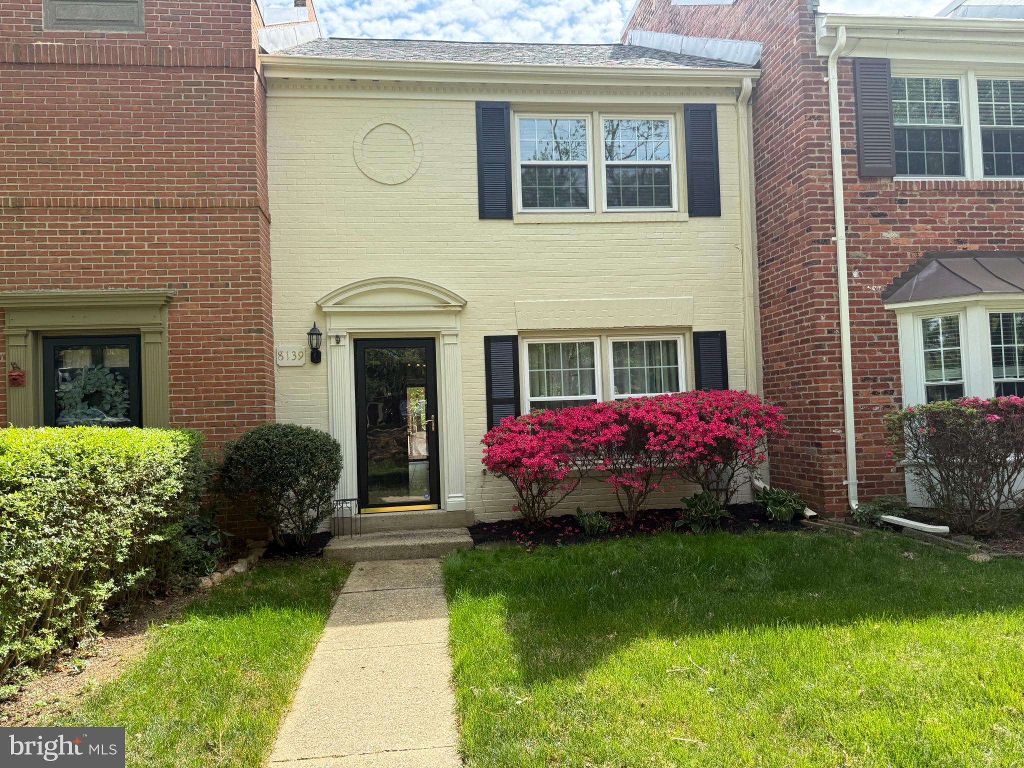 8139 Carrleigh Parkway Springfield, VA 22152 - Photo 27 of 27 a front view of a house with garden