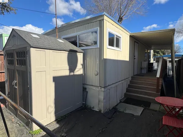 a view of a house with wooden floor and stairs