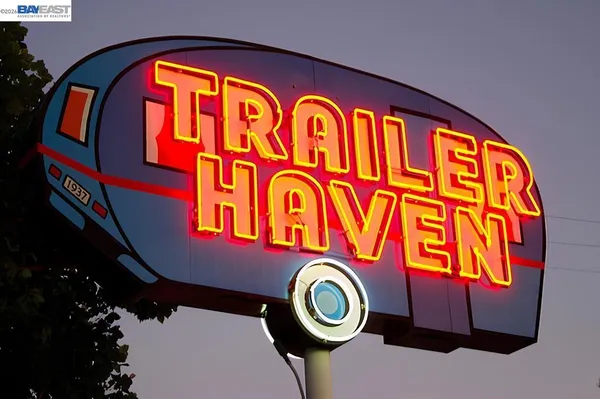 a front view of a door and a sign board