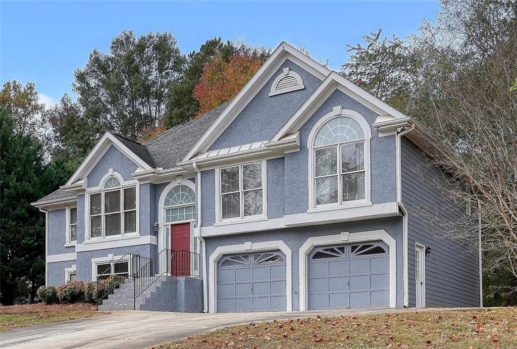 203 Whitestone Drive Canton, GA 30115 - Photo 1 of 1 a front view of a house with a yard