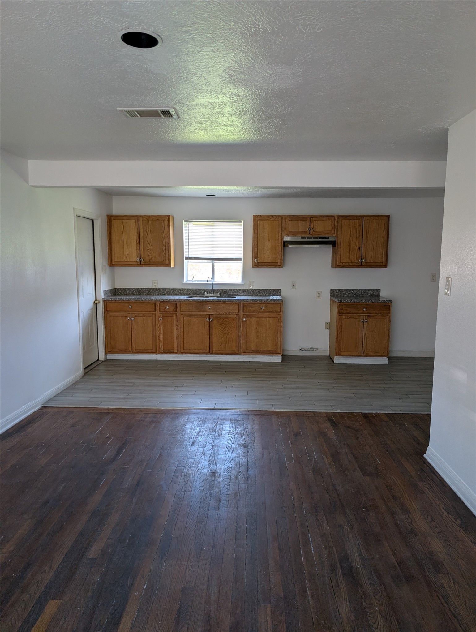 109 East Parker Road Houston, TX 77076 - Photo 2 of 11 a bedroom with a bed and a dresser