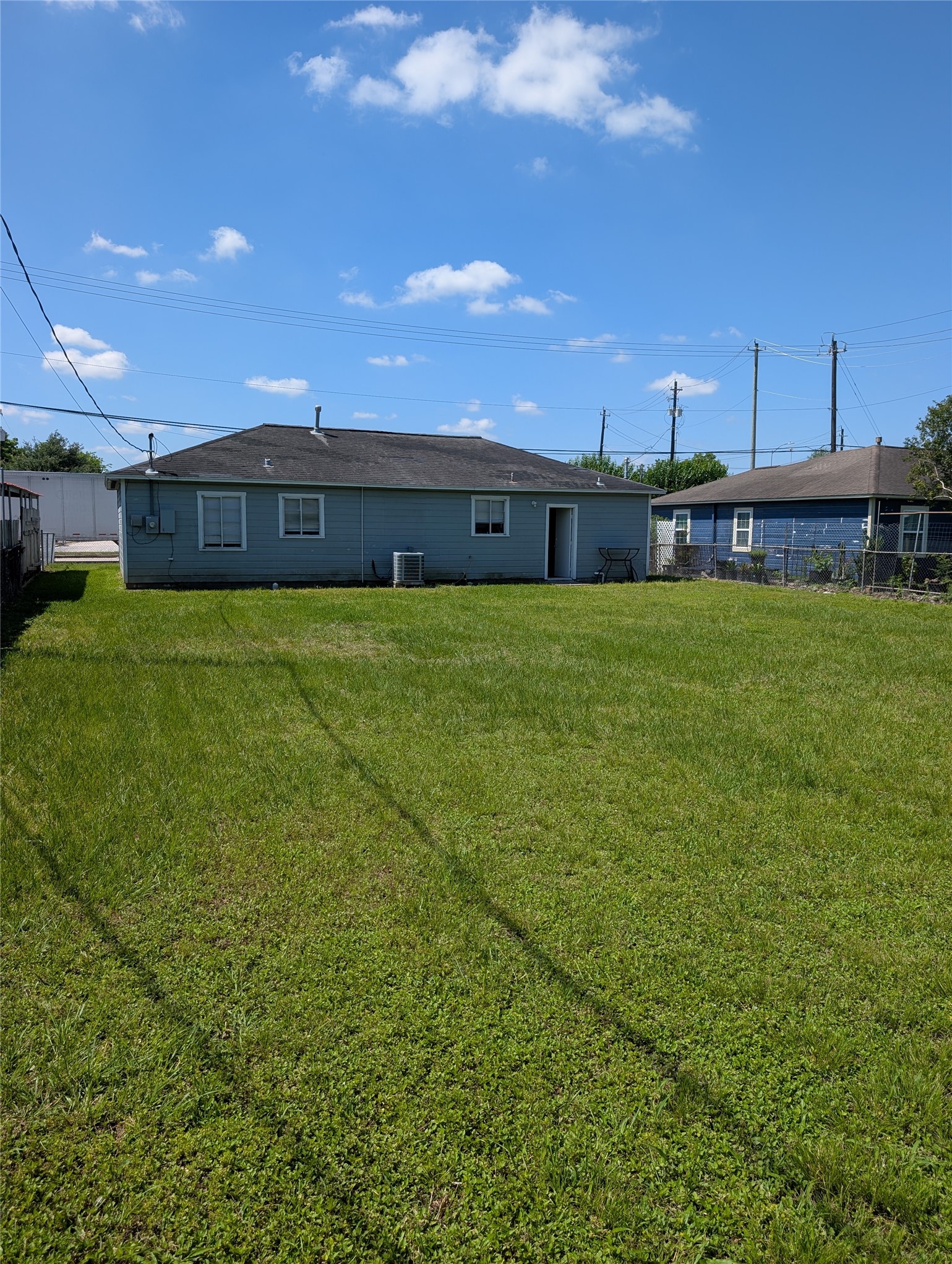 109 East Parker Road Houston, TX 77076 - Photo 4 of 11 a view of a house next to a yard