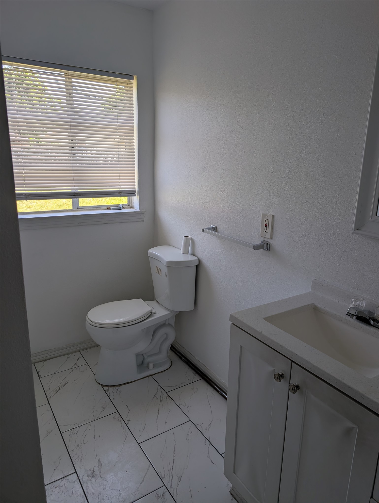 109 East Parker Road Houston, TX 77076 - Photo 9 of 11 a white toilet sitting next to a bathroom sink