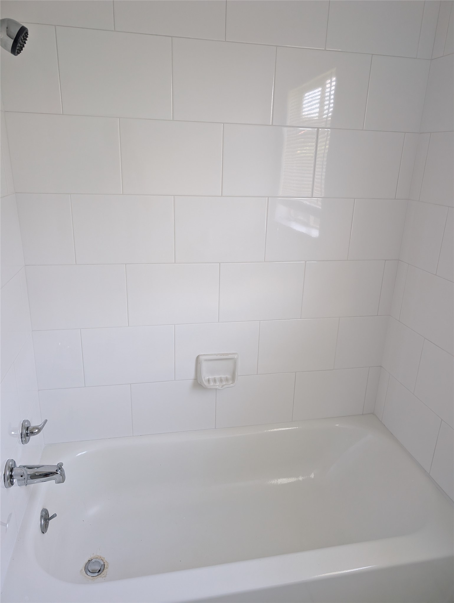 109 East Parker Road Houston, TX 77076 - Photo 10 of 11 a close up of a bathtub in a bathroom
