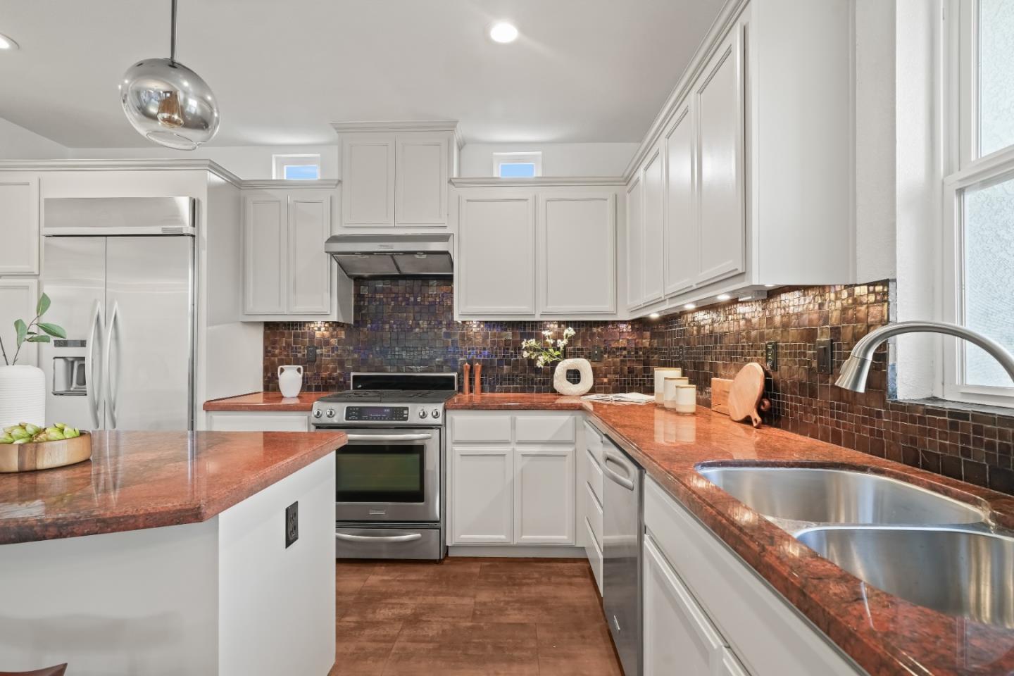 451 Chagall Street Mountain View, CA 94041 - Photo 24 of 58 a kitchen with stainless steel appliances granite countertop a sink stove and refrigerator