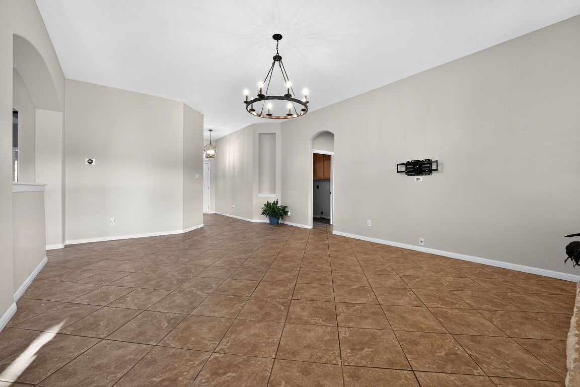 1021 Westland Ridge Road Dripping Springs, TX 78620 - Photo 12 of 31 a view of a chandelier in an empty room