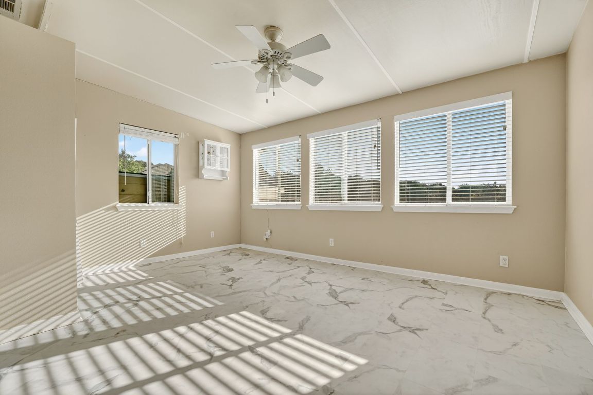 1021 Westland Ridge Road Dripping Springs, TX 78620 - Photo 22 of 31 a view of an empty room with a window