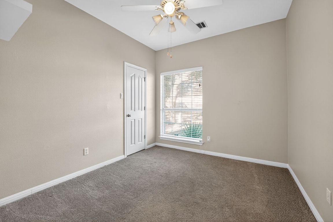 1021 Westland Ridge Road Dripping Springs, TX 78620 - Photo 26 of 31 a view of an empty room with a window