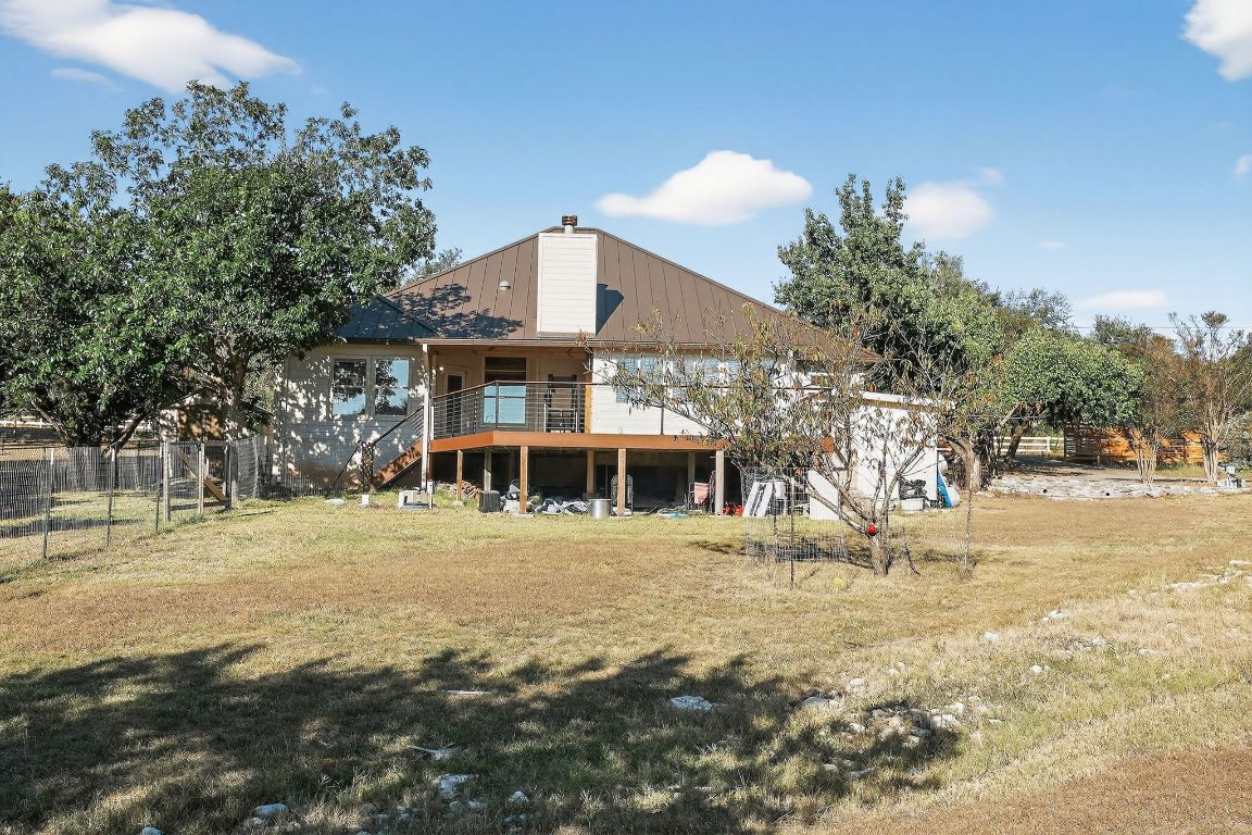 1021 Westland Ridge Road Dripping Springs, TX 78620 - Photo 29 of 31 a front view of a house with a yard