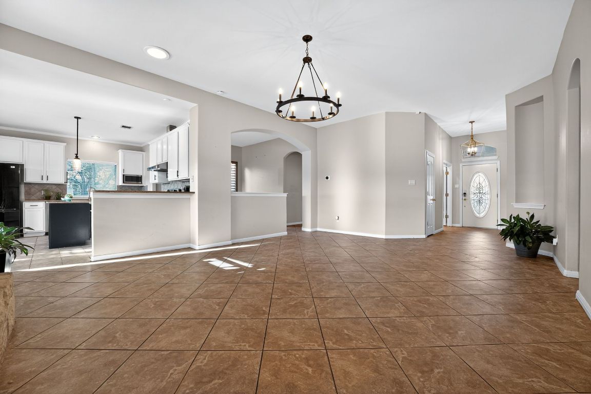 1021 Westland Ridge Road Dripping Springs, TX 78620 - Photo 9 of 31 a view of a kitchen with a sink and microwave