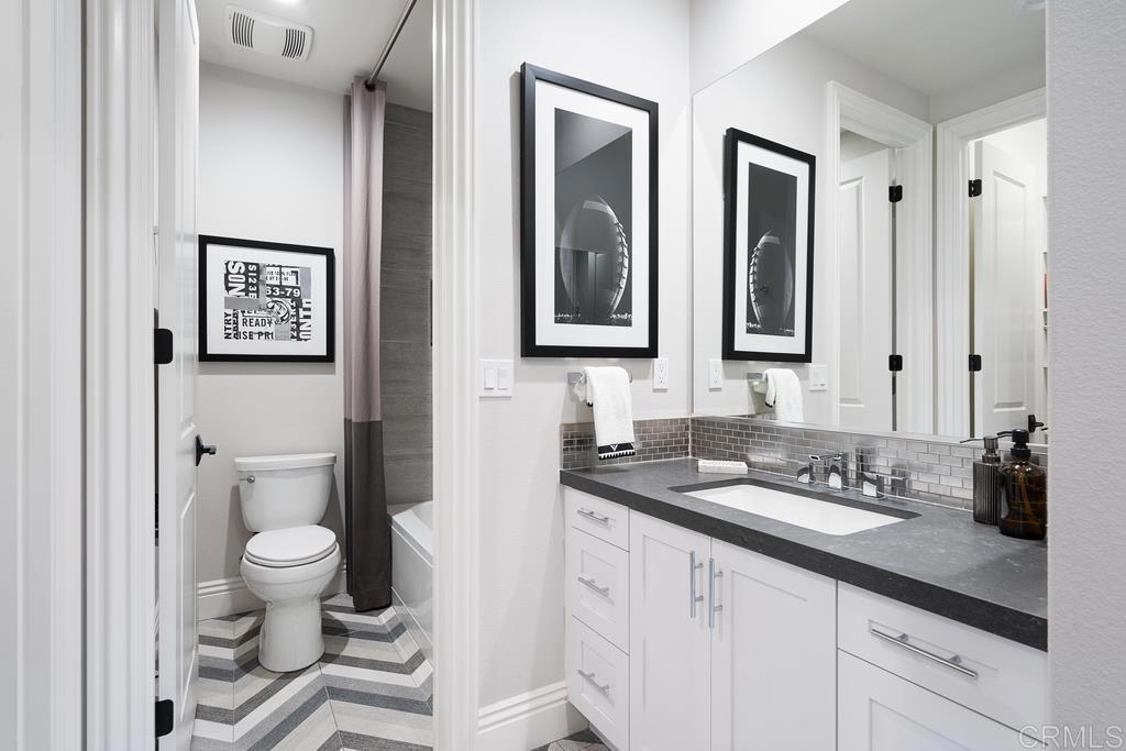 15527 Artesian Ridge San Diego, CA 92127 - Photo 13 of 32 a bathroom with a granite countertop sink and a mirror