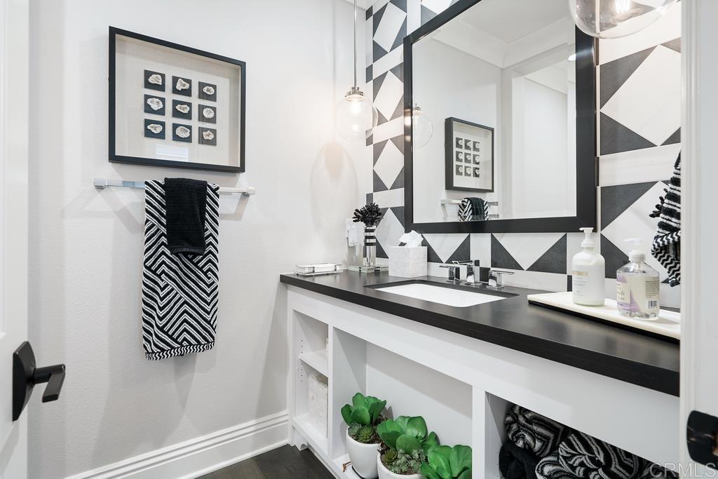 15527 Artesian Ridge San Diego, CA 92127 - Photo 15 of 32 a bathroom with a sink and a mirror