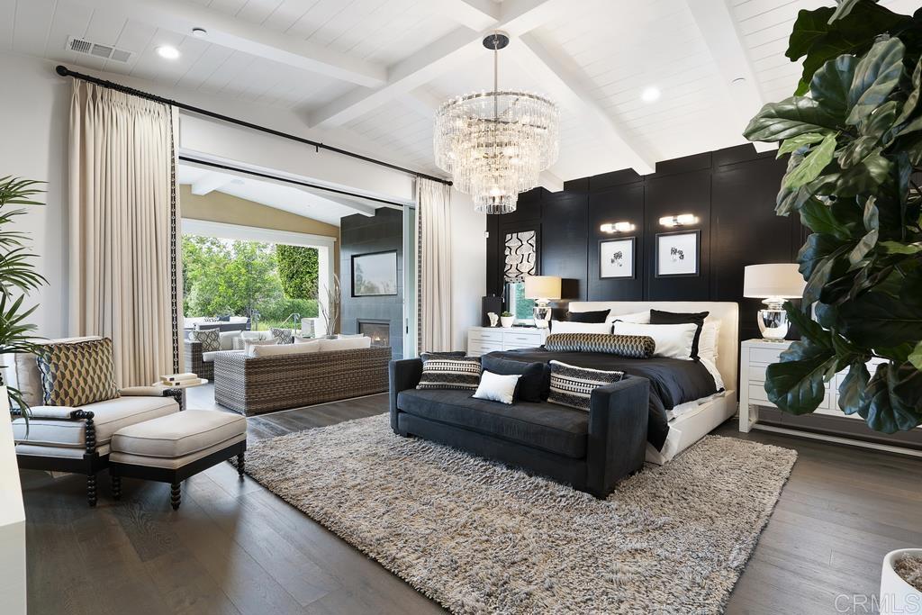 15527 Artesian Ridge San Diego, CA 92127 - Photo 16 of 32 a living room with furniture and a chandelier