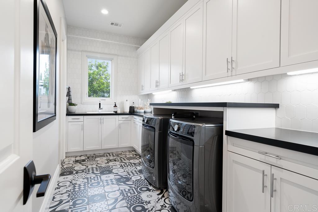 15527 Artesian Ridge San Diego, CA 92127 - Photo 19 of 32 a kitchen with a sink and cabinets