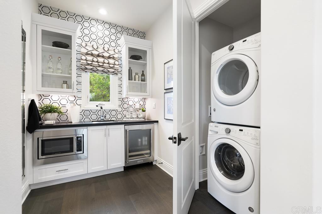 15527 Artesian Ridge San Diego, CA 92127 - Photo 20 of 32 a utility room with sink dryer and washer