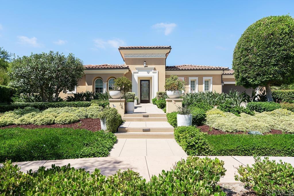 15527 Artesian Ridge San Diego, CA 92127 - Photo 2 of 32 a front view of a house with yard and green space