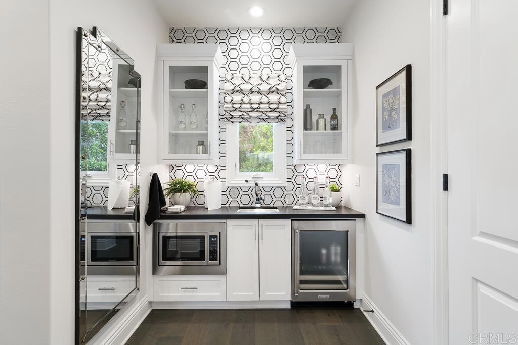 15527 Artesian Ridge San Diego, CA 92127 - Photo 22 of 32 a bathroom with a granite countertop sink and a mirror