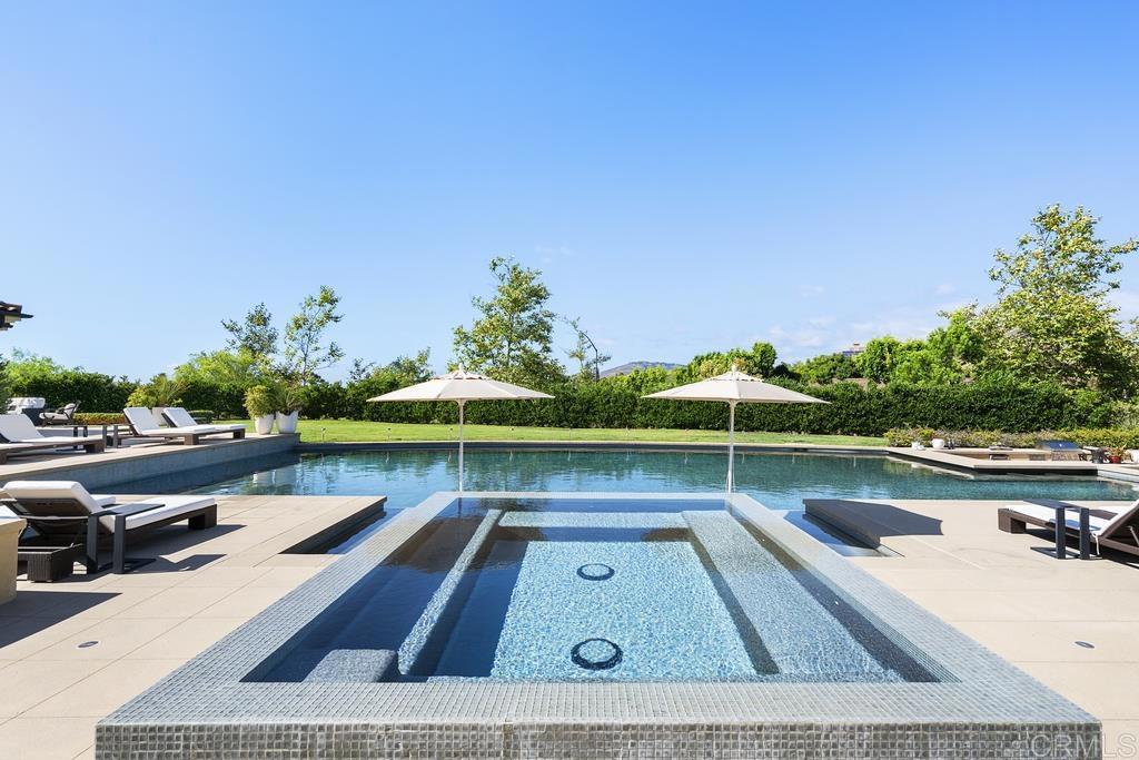 15527 Artesian Ridge San Diego, CA 92127 - Photo 24 of 32 a view of a swimming pool and lounge chairs