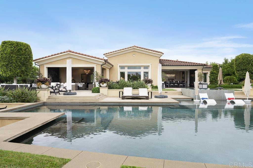 15527 Artesian Ridge San Diego, CA 92127 - Photo 25 of 32 a view of a patio with couches and a table and chairs