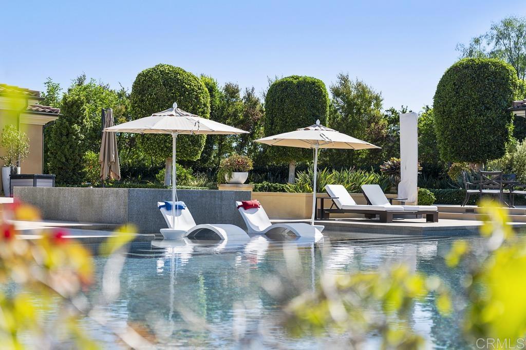 15527 Artesian Ridge San Diego, CA 92127 - Photo 26 of 32 a view of pool with table and chairs under an umbrella