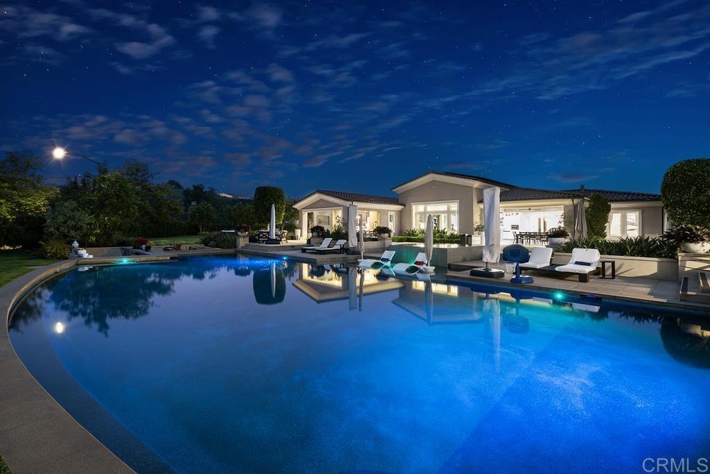 15527 Artesian Ridge San Diego, CA 92127 - Photo 29 of 32 a swimming pool with outdoor seating and yard