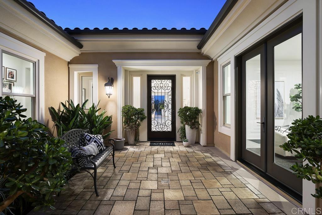15527 Artesian Ridge San Diego, CA 92127 - Photo 31 of 32 a porch with seating space and garden
