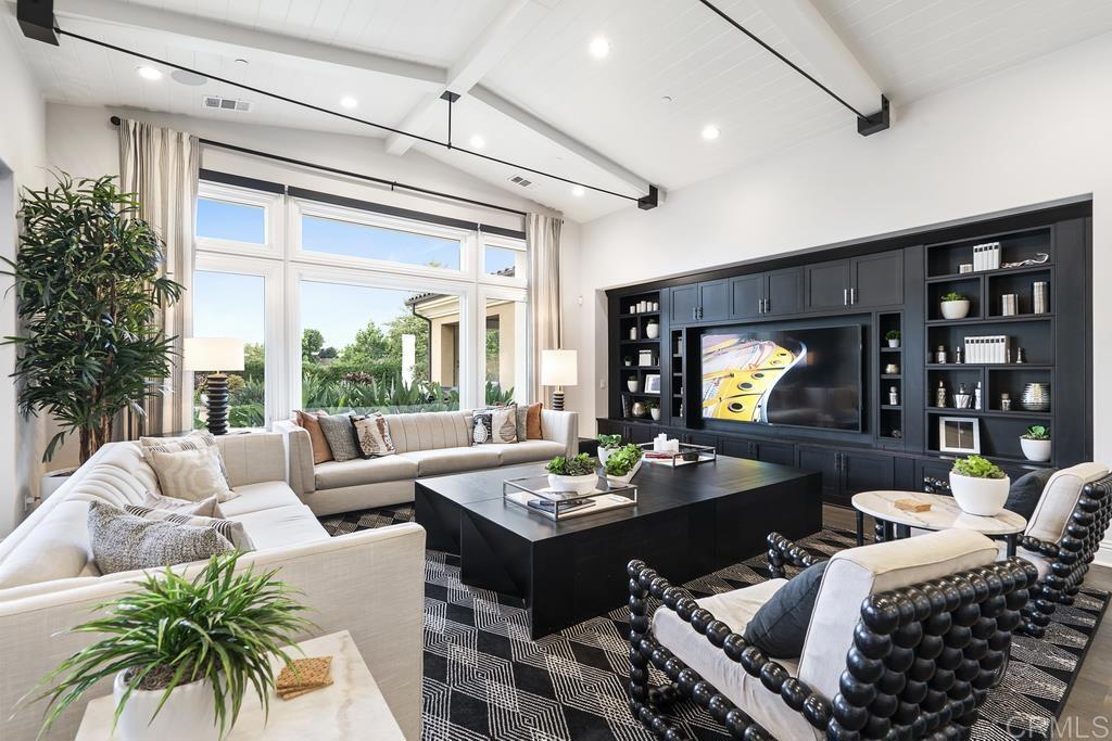 15527 Artesian Ridge San Diego, CA 92127 - Photo 6 of 32 a living room with furniture and a flat screen tv