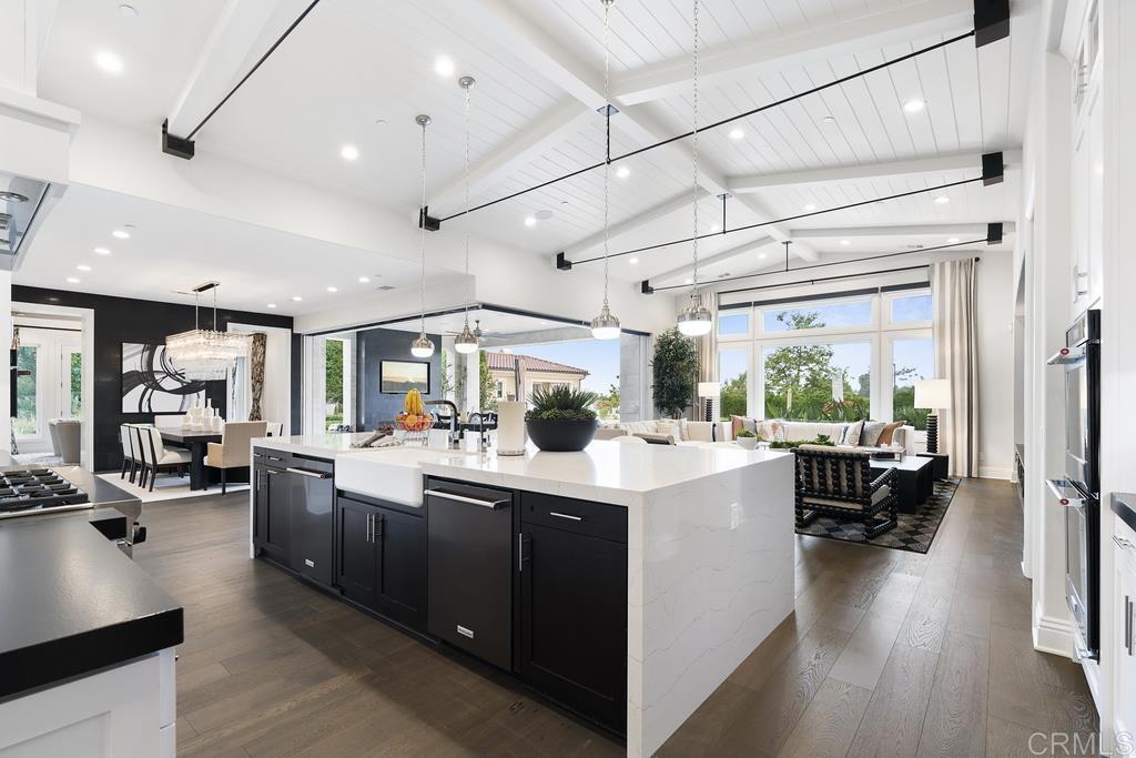 15527 Artesian Ridge San Diego, CA 92127 - Photo 9 of 32 a kitchen with a sink a counter top space and stainless steel appliances