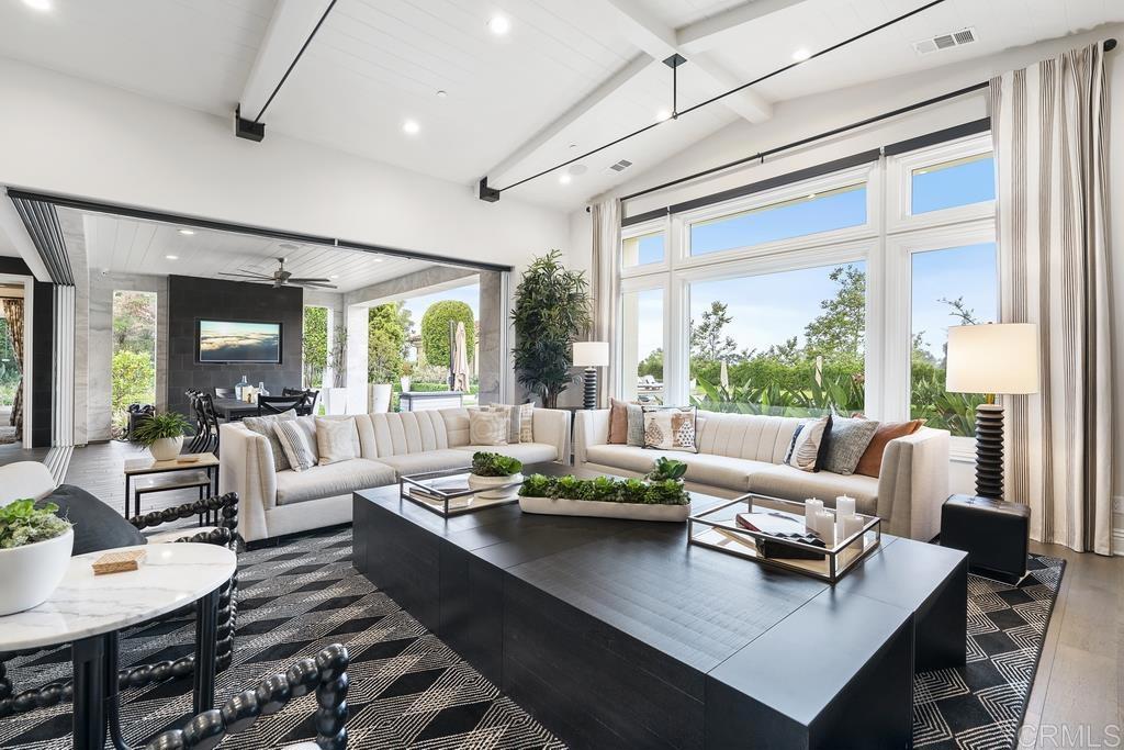 15527 Artesian Ridge San Diego, CA 92127 - Photo 10 of 32 a living room with furniture and a large window