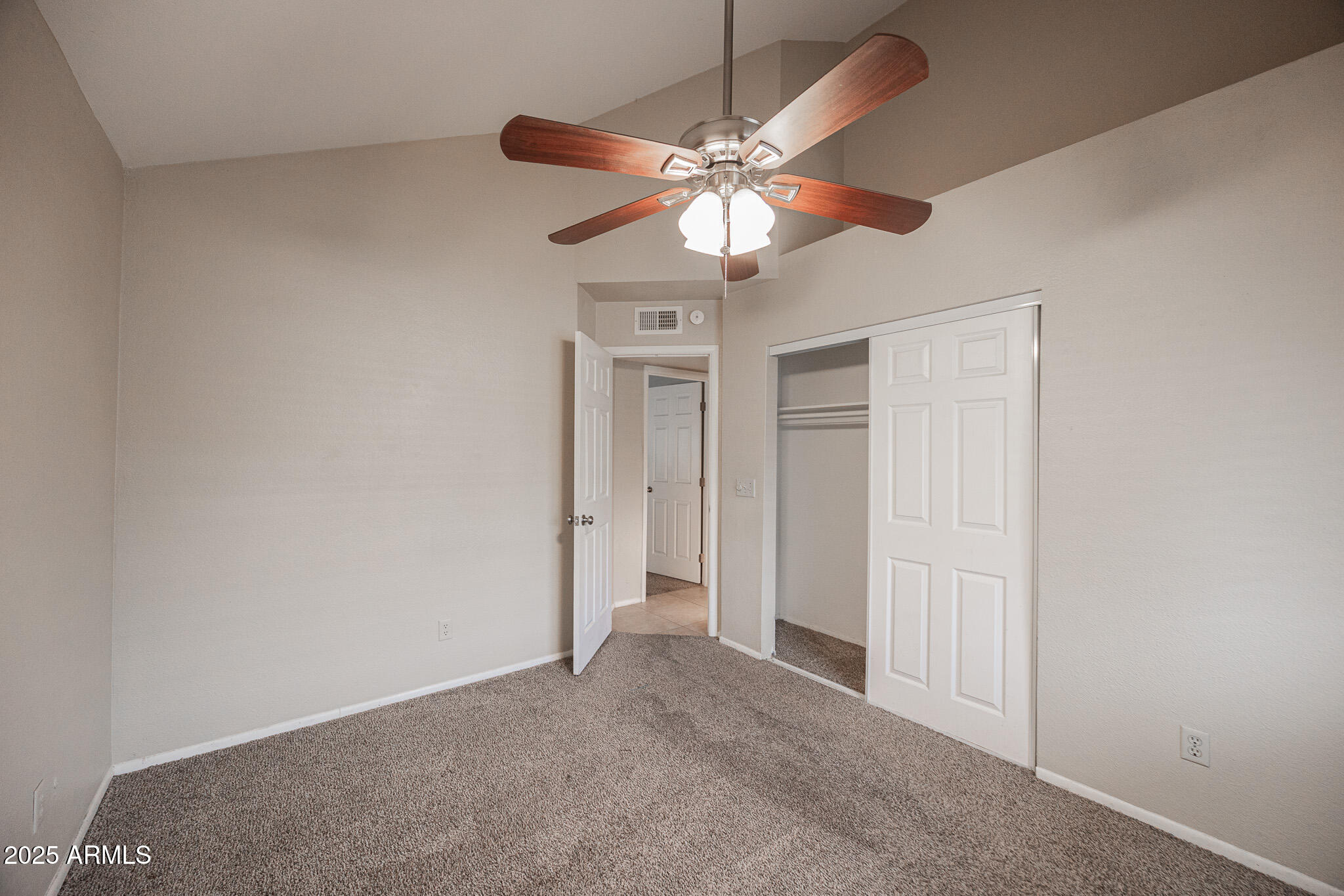 2127 East 10th Street, Unit 4 Tempe, AZ 85281 - Photo 13 of 21 an empty room with a fan and a fan