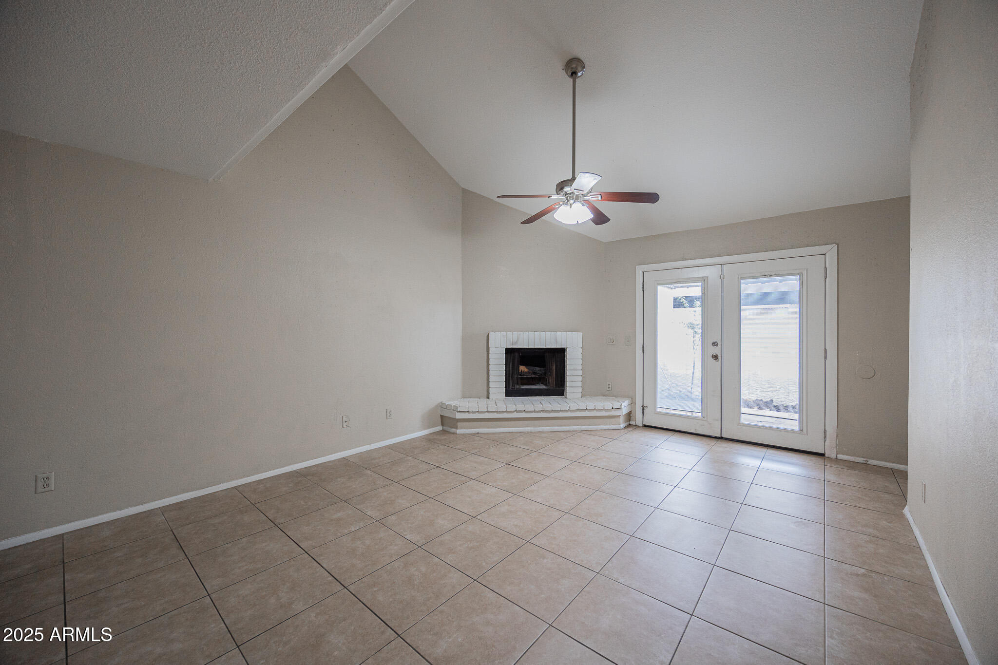 2127 East 10th Street, Unit 4 Tempe, AZ 85281 - Photo 5 of 21 a view of an empty room with a fireplace and a window