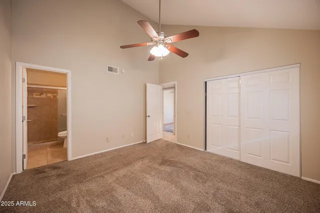 a view of a livingroom with a chandelier fan