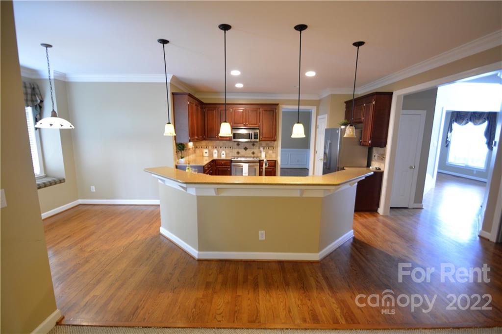 2127 Copperplate Road Charlotte, NC 28262 - Photo 16 of 37 a view of living room with furniture and wooden floor