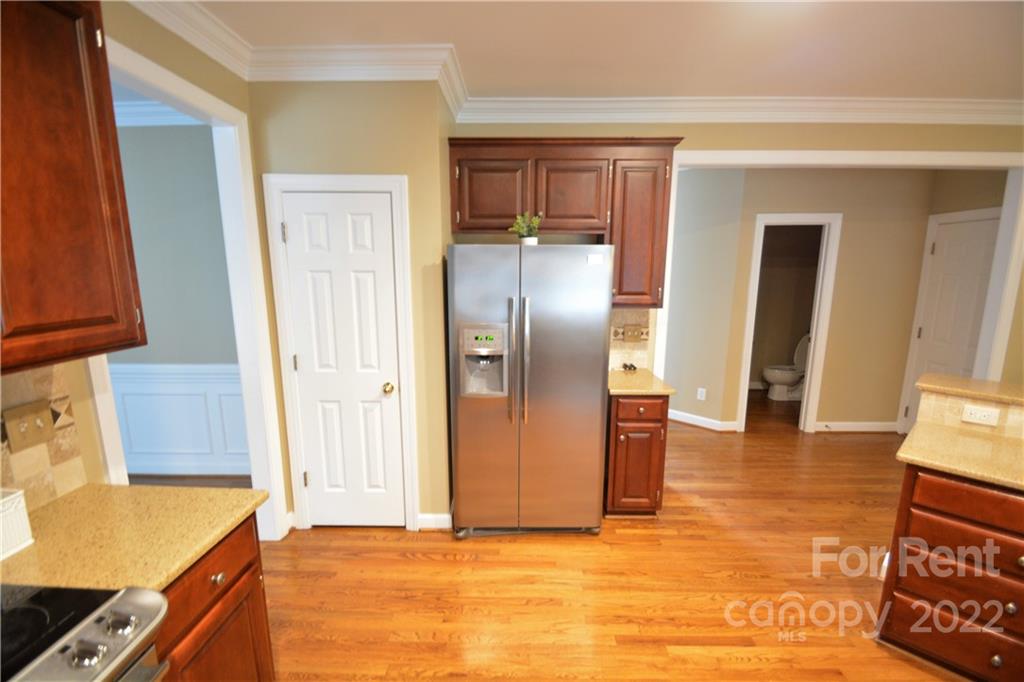 2127 Copperplate Road Charlotte, NC 28262 - Photo 17 of 37 a view of a kitchen with furniture and a kitchen