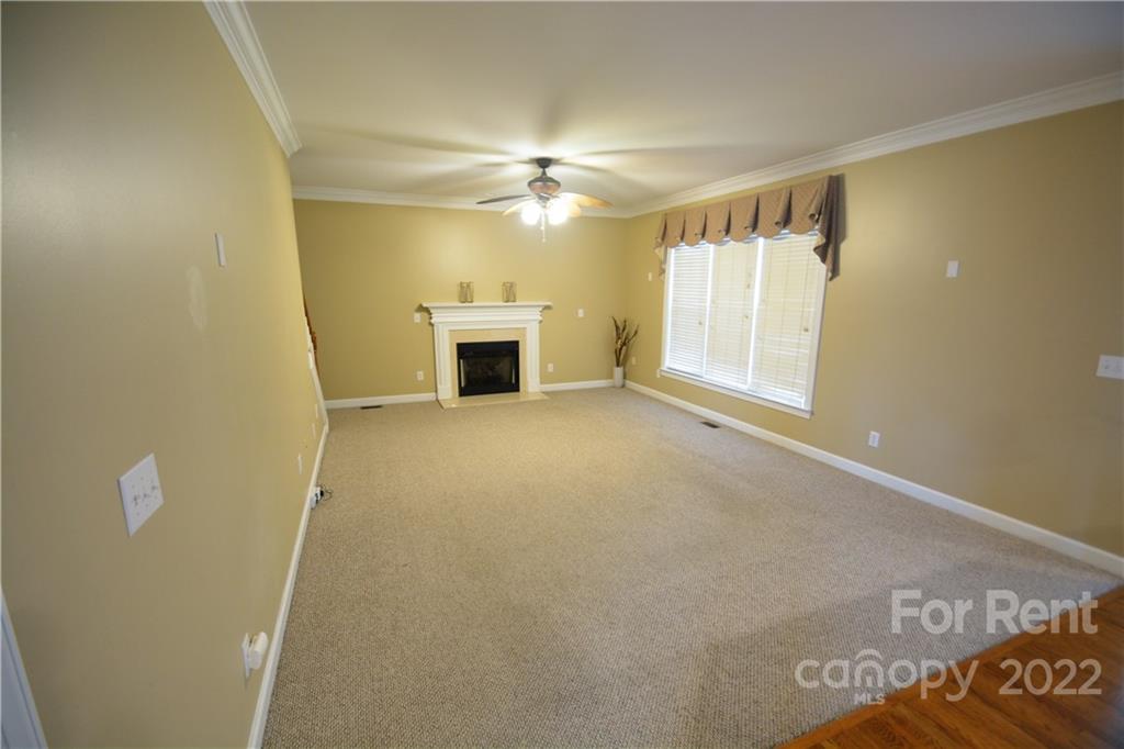 2127 Copperplate Road Charlotte, NC 28262 - Photo 19 of 37 a view of a livingroom with a fireplace