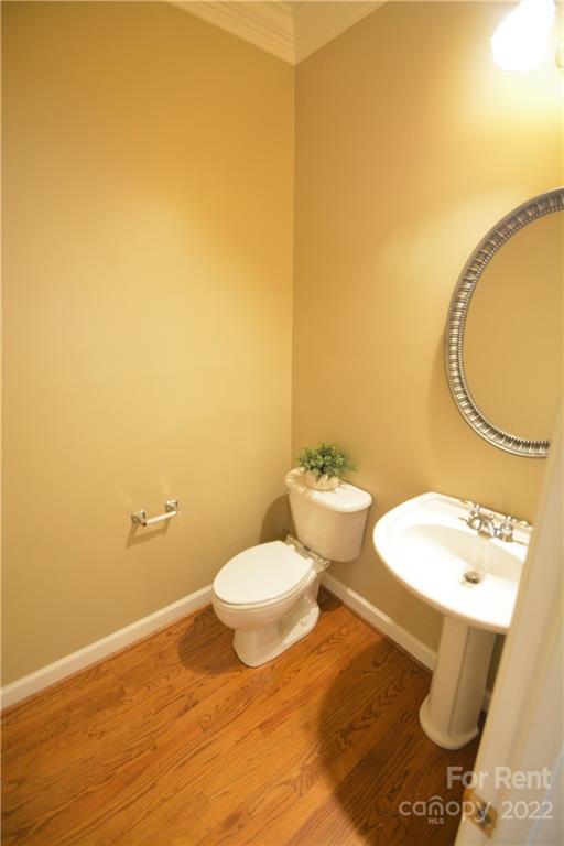 2127 Copperplate Road Charlotte, NC 28262 - Photo 20 of 37 a bathroom with a sink and a mirror
