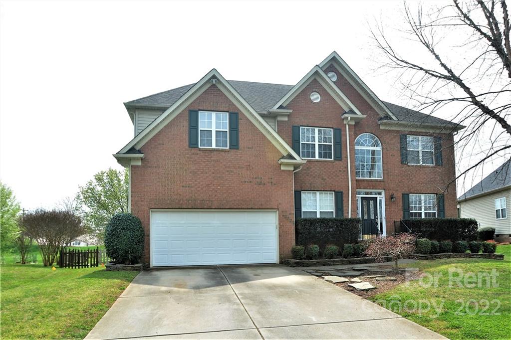 2127 Copperplate Road Charlotte, NC 28262 - Photo 2 of 37 a front view of a house with a yard