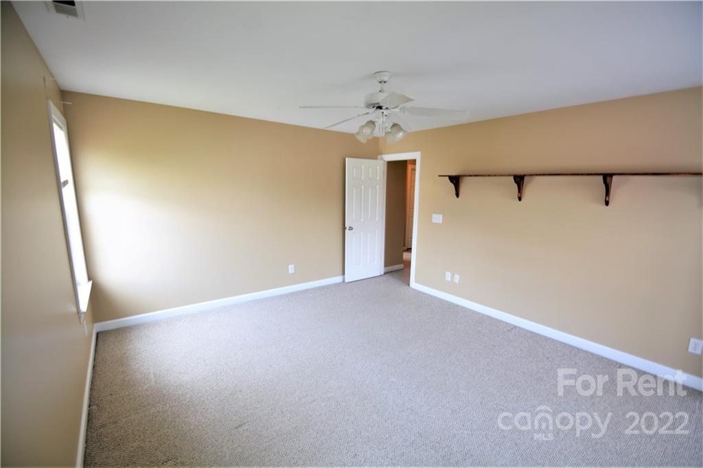 2127 Copperplate Road Charlotte, NC 28262 - Photo 28 of 37 a view of an empty room with a window