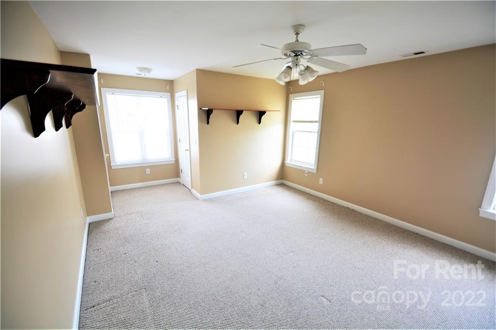 2127 Copperplate Road Charlotte, NC 28262 - Photo 29 of 37 a view of a livingroom with a ceiling fan and window