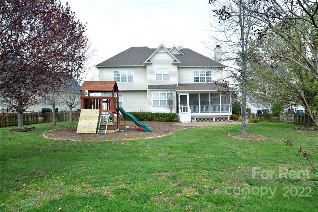 2127 Copperplate Road Charlotte, NC 28262 - Photo 36 of 37 a view of a house with a yard patio and fire pit