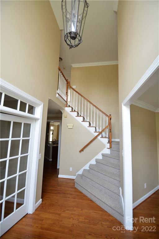 2127 Copperplate Road Charlotte, NC 28262 - Photo 5 of 37 a view of entryway and hall with wooden floor