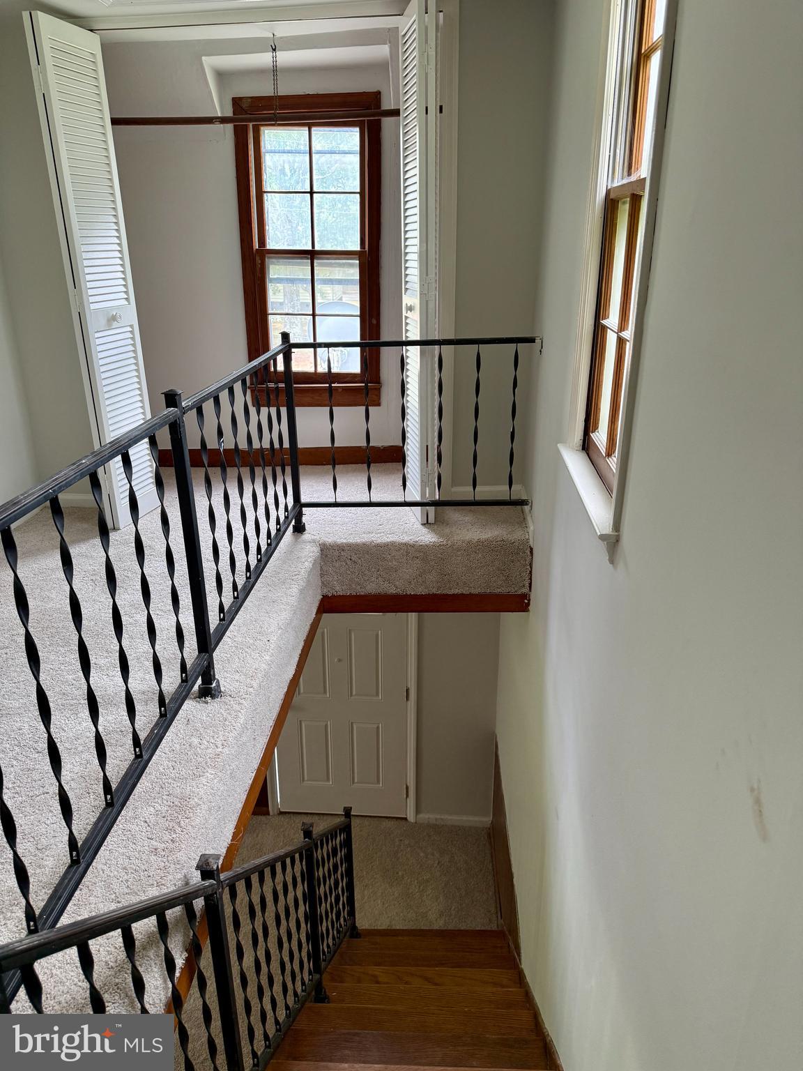1031 MacDonald Road Scottsburg, VA 24589 - Photo 14 of 43 a view of staircase with railing and white walls