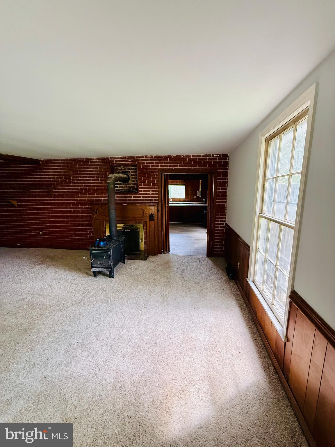 1031 MacDonald Road Scottsburg, VA 24589 - Photo 36 of 43 a view of an empty room with furniture and a window