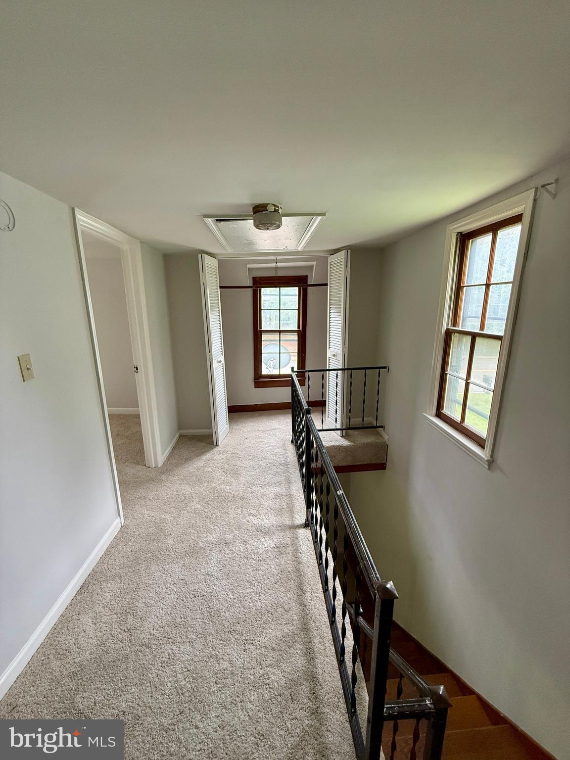 1031 MacDonald Road Scottsburg, VA 24589 - Photo 38 of 43 wooden floor in an empty room with a window