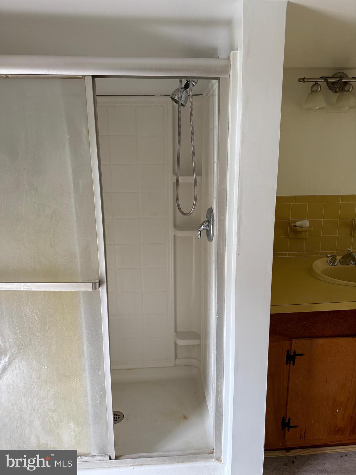 1031 MacDonald Road Scottsburg, VA 24589 - Photo 42 of 43 a bathroom with a glass shower door